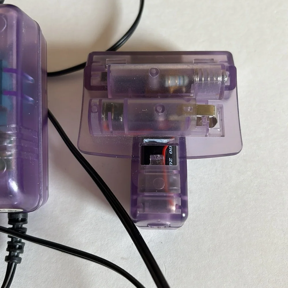 AC/DC power adapter and 2 battery packs for Nintendo Game Boy Color